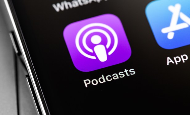 Apple iPhone with Podcasts icon app on screen